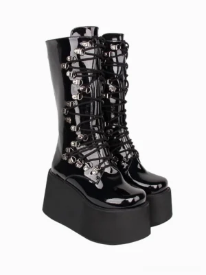 Gothic Lolita platform mid-calf boots inner side three-quarter view displaying glossy black patent PU leather and silver lacing hardware system