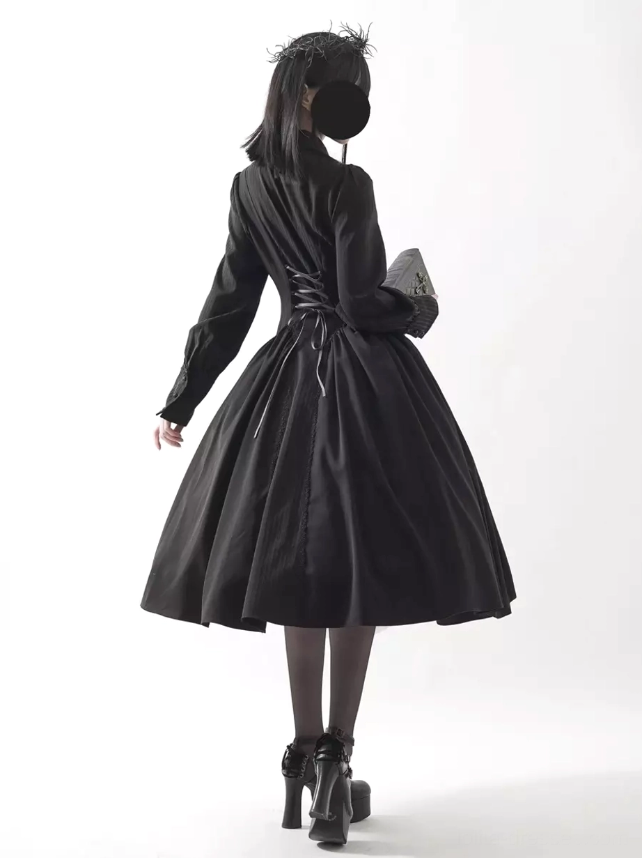 Black Gothic Lolita long sleeve dress back view, featuring corset-style lace-up back detail, full flared midi skirt, long sleeves, and Victorian aesthetic