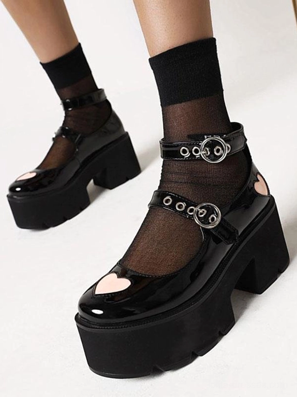 Black gothic lolita Mary Jane platform shoes front three-quarter view with heart toe decoration and double buckle ankle straps, worn with black sheer socks