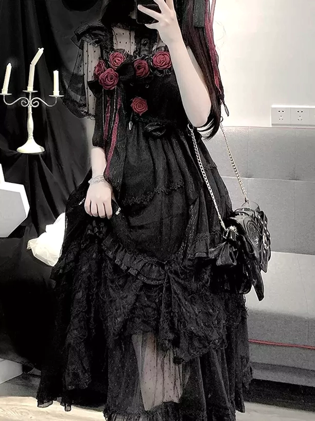 Black Gothic Lolita dress with sheer dotted mesh skirt layers and red rose decorations side mirror view