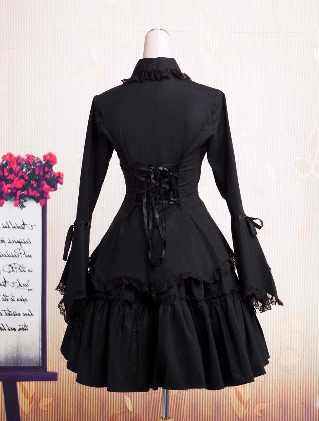 Black Gothic Lolita OP dress back view showcasing corset lace-up back and layered tiered ruffles