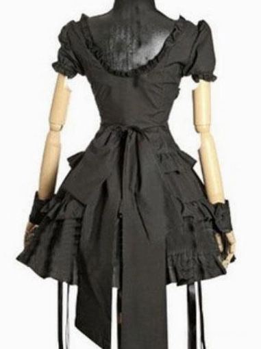 Black Gothic Lolita one-piece dress back view showing ruffled square neckline, large decorative bow sash, and layered ruffled hem, rear display on mannequin