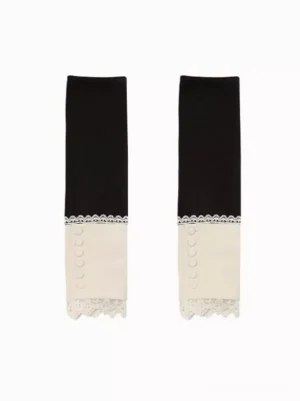 Black gothic lolita oversleeves with decorative buttons and ecru lace hem trim flat lay design