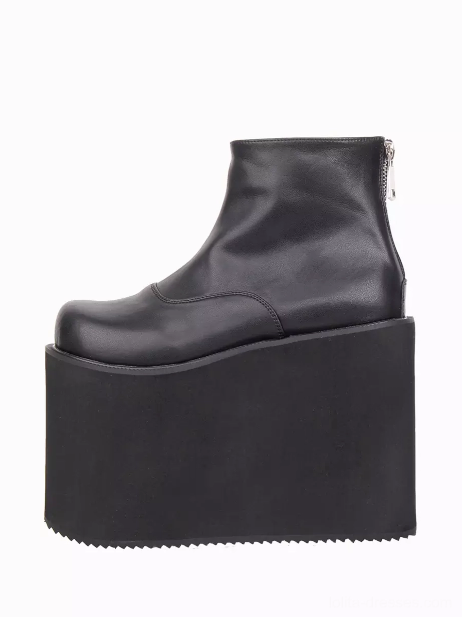 Single black platform lolita boot right side profile view displaying serrated anti-slip outsole matte PU leather and rear zipper design