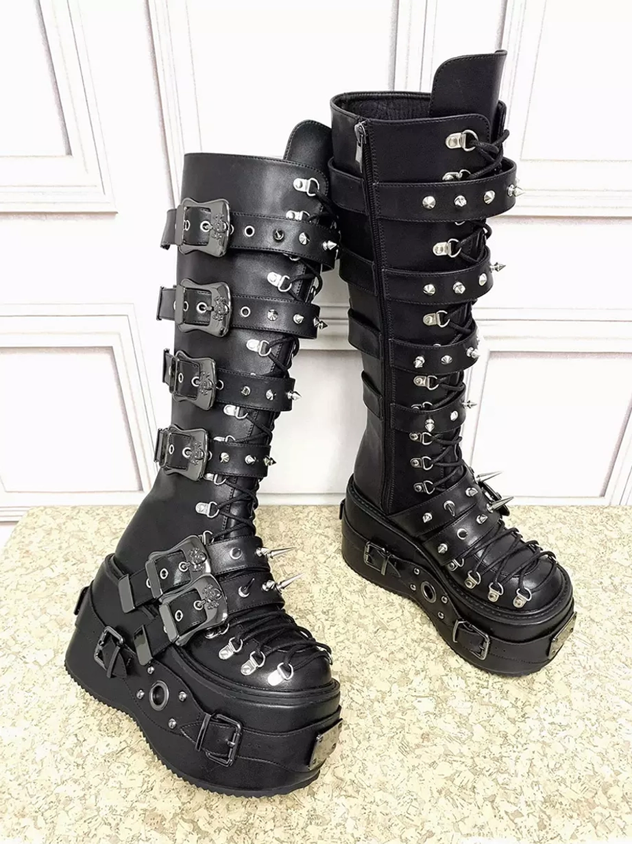 Side oblique angle of black Gothic Lolita platform boots showing studded buckle straps, thick platform sole, and knee-high shaft structure