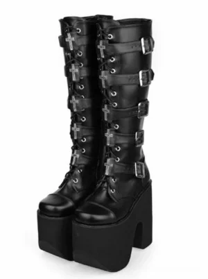 Front paired display of black chunky platform boots with multiple silver buckles and cross embellishments, showcasing lace-up construction