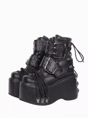 Black gothic lolita platform boots with dual buckle straps and front lace tassels, front three-quarter view showing round toe and metal hardware details
