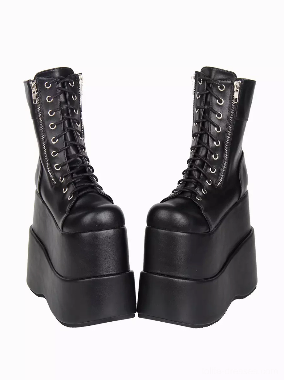 Pair of black gothic lolita platform boots direct frontal view displaying symmetric design and round toe profile