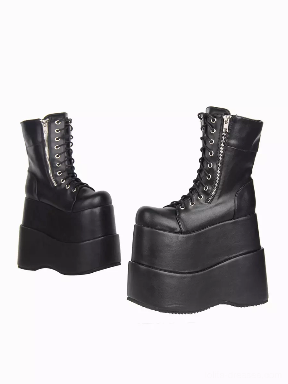 Black gothic lolita platform boots rear three-quarter angle showing layered thick wedge sole and lace-up front construction