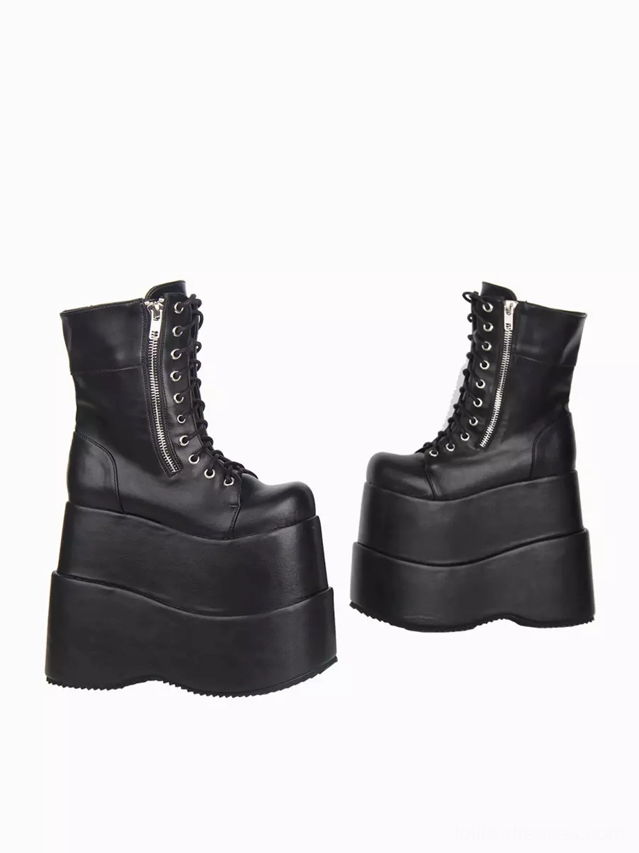 Black gothic lolita boots side profile displaying lace eyelets, side zipper design, and architectural wedge platform heel construction