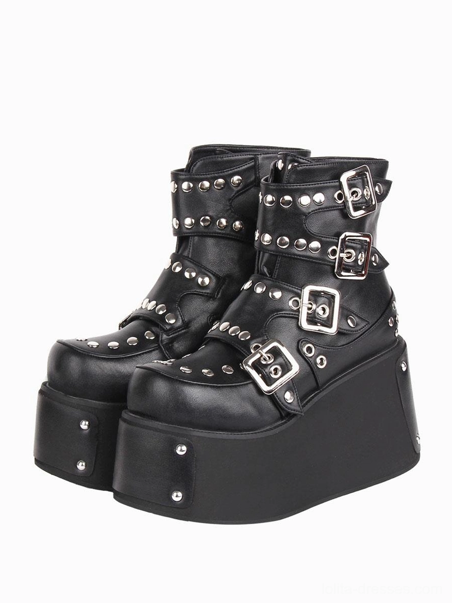 Black Gothic Lolita platform boots with silver grommets and metal buckle straps front three-quarter view round toe wedge heel