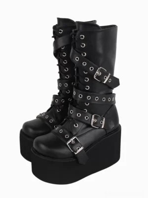 Black gothic lolita platform boots with silver metallic grommets and buckle straps, front three-quarter view showing round toe and thick wedge heel