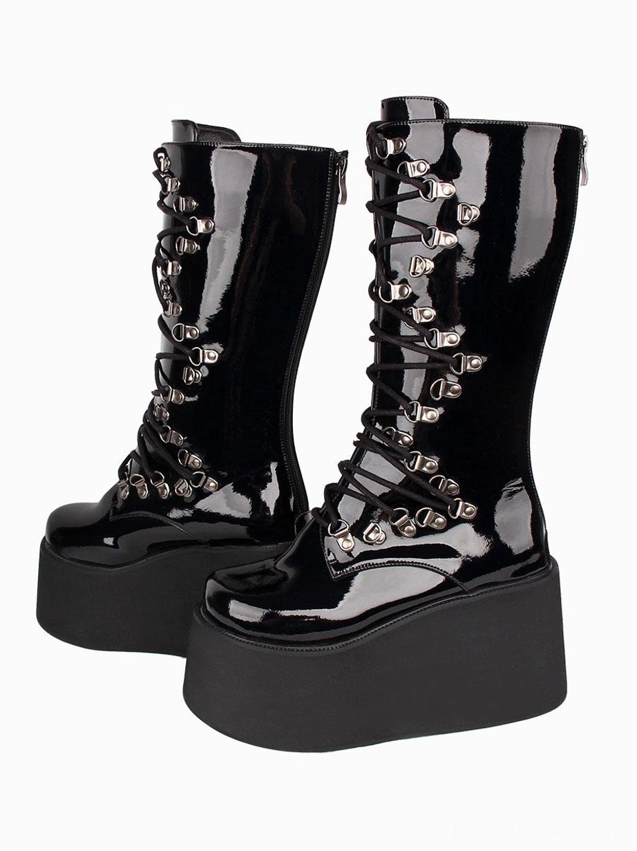 Gothic Lolita platform boots front-side three-quarter view featuring black patent PU material silver grommet lace details and extra thick wedge platform