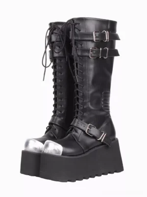 Black gothic lolita platform boots front three-quarter view showing silver metal toe cap, lace-up front with grommets, adjustable buckle straps, and chunky ridged platform sole