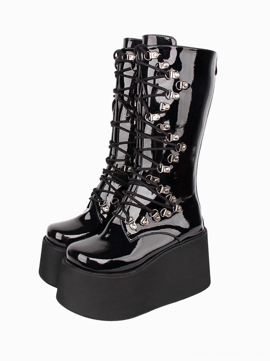 Black Gothic Lolita platform boots with silver metal grommets and lace-up design front full view showcasing round toe cap and thick wedge sole