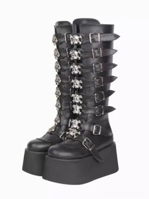 Black gothic lolita platform boots with skull buckle strap decorations and silver hardware, front three-quarter view showing round toe and thick wedge platform sole