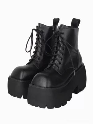 Black Gothic Lolita platform boots front three-quarter view showing square toe design, lace-up fastening system, and chunky lug sole platform heel