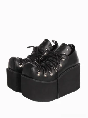 Black gothic lolita platform pumps with silver metal grommets and thick wedge heel, front paired view showing lace-up construction and round toe design