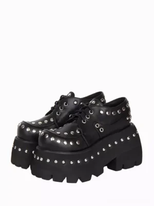 Black Gothic Lolita platform pumps with silver rivets front view high angle showing round toe and lace-up design on white background
