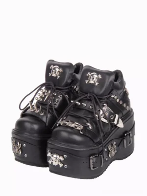 Black gothic lolita platform pumps front three-quarter view featuring silver skull hardware rivets and chain buckle straps on white background