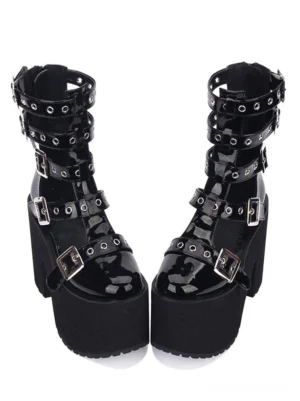 Black gothic lolita platform sandal with grommeted buckle straps front view, glossy PU leather, chunky platform heel, rounded toe design, flat lay product photography