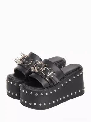 Black gothic lolita platform slide sandals front oblique view featuring silver round rivets on thick sole and metal spike buckle strap decorations on white background