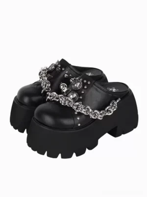 Black Gothic Lolita platform mule sandals pair front three-quarter view silver chain studs metallic finish chunky serrated sole studio product photography