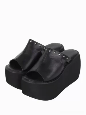 Black gothic lolita platform sandals with silver rivets front three-quarter view showing open toe design chunky wedge heel