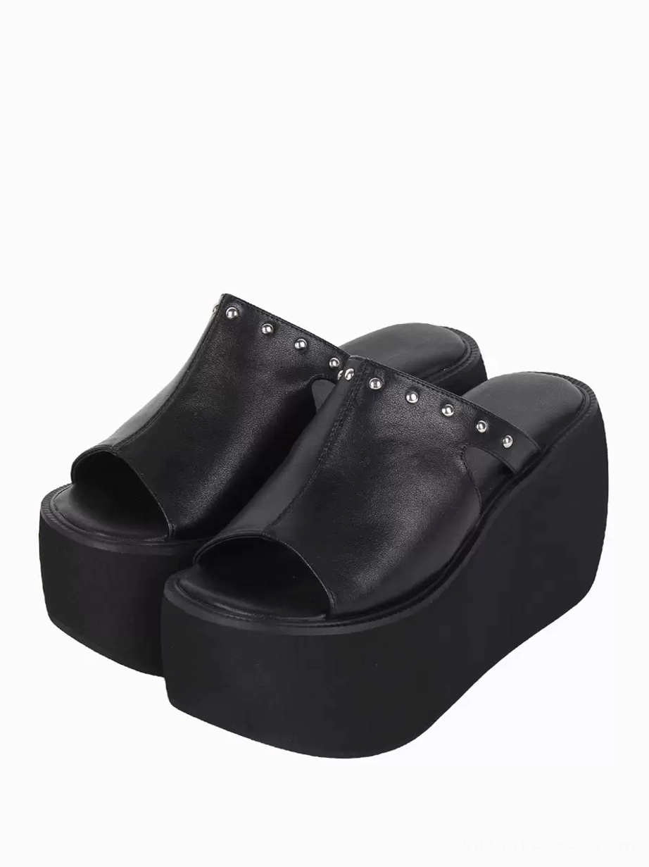 Black gothic lolita platform sandals with silver rivets front three-quarter view showing open toe design chunky wedge heel