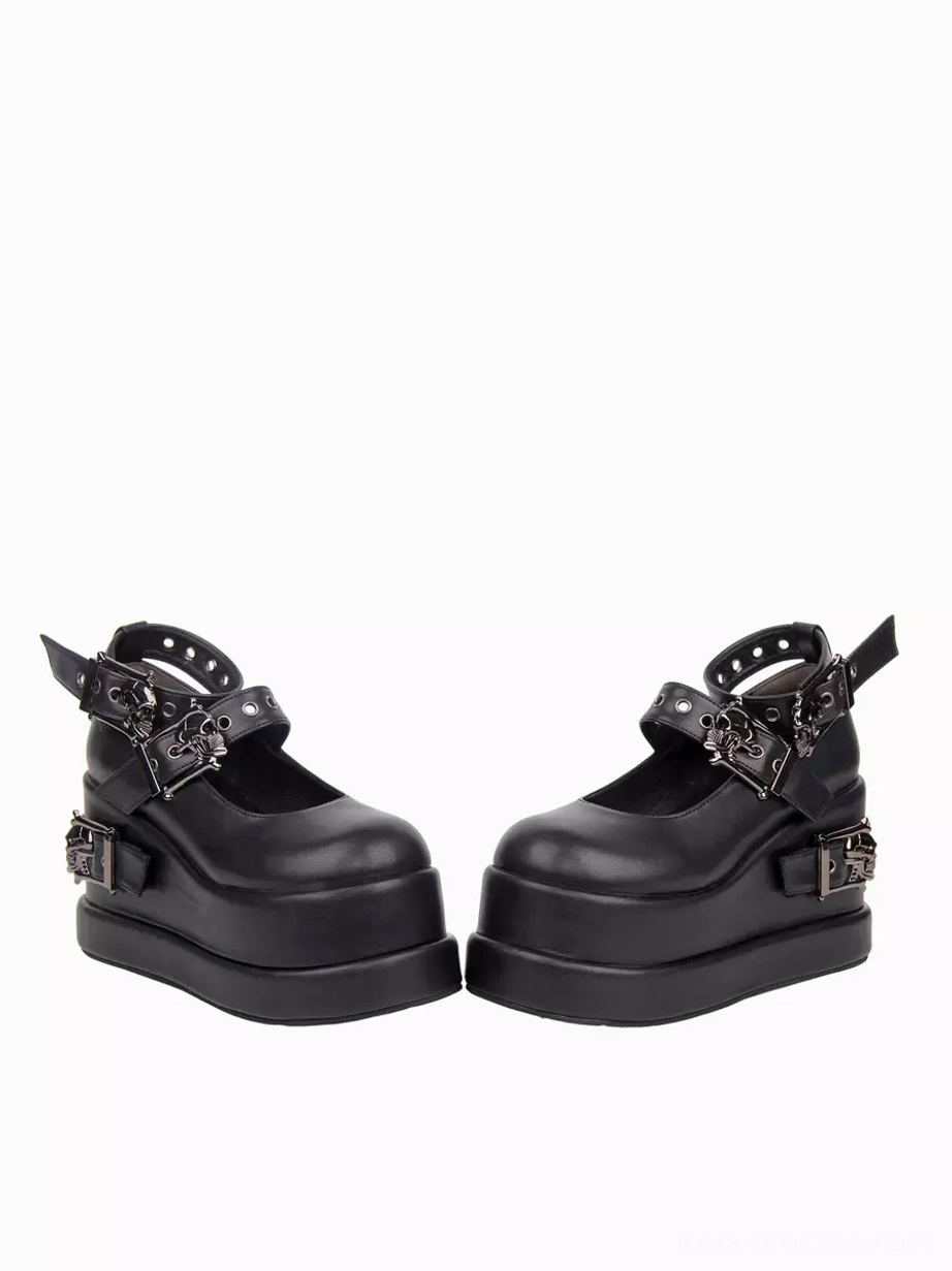 Pair of black Gothic Lolita platform shoes back three-quarter view highlighting eyelet ankle strap skull metal hardware and thick platform midsole