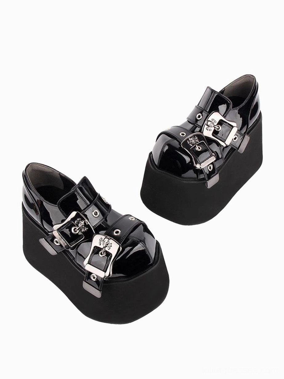 black gothic lolita platform pumps side profile displaying double silver decorative grommets and matte platform base construction