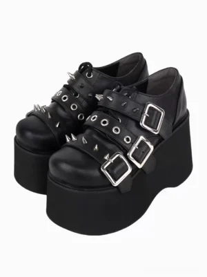 Black gothic lolita platform pumps with silver metallic grommets and studs, double-shoe oblique top-down display showing full shoe silhouette and metallic embellishments