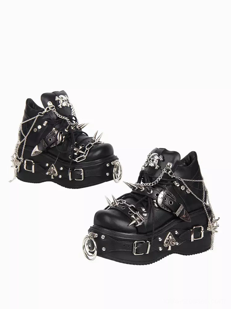 Black Gothic Lolita platform pumps showing detailed silver studs chains and skull motifs front low angle view