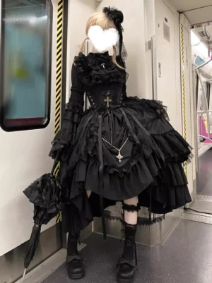 Black Gothic Lolita formal dress full body side view wearing platform boots and lace socks with cross pendant accessory