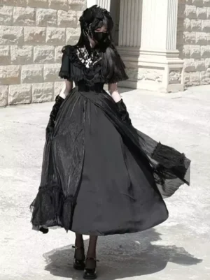 Black Gothic Lolita dress front view with ruffled lace short sleeves and A-line skirt silhouette, worn by model with black gloves outdoors