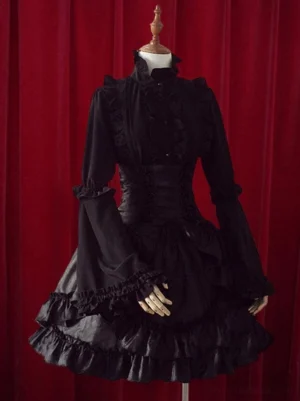 Black gothic lolita skirt with cascading layered ruffles worn on mannequin front view showing high-waisted silhouette and structured cotton-satin fabric