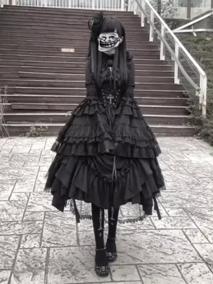 Black gothic lolita vintage gown front angle showing two-tiered ruffled skirt, corset waist with cross ornament, and full long sleeves