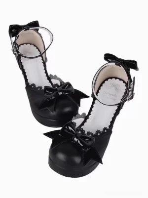 Black gothic lolita wedge sandals with dual glossy bows pair overhead view open toe design lace-trimmed inner sole