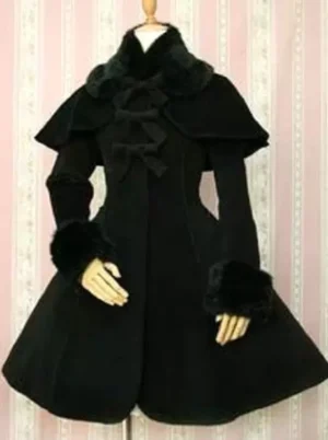Black Gothic Lolita winter coat with detachable cape and faux fur trim front view, A-line silhouette with bow accents and button closure