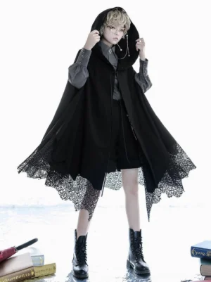 Black gothic Ouji hooded poncho cape with irregular lace hem worn by androgynous model front view