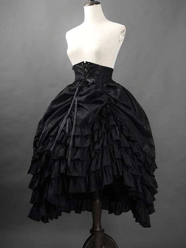 Black Gothic Ouji lolita skirt mannequin display showing corset waist details, intricate jacquard weave texture, and voluminous tiered ruffled construction
