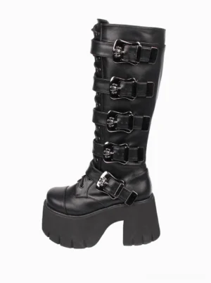 Single black gothic platform boot right side three quarter view displaying metal skull buckles and thick platform sole