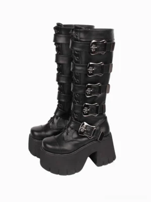 Black gothic platform boots with skull grommets paired display front view showing round toe and chunky wedge heel