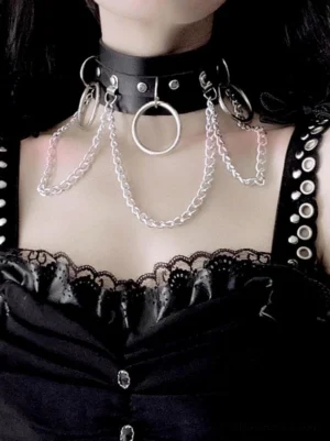Black leather gothic punk choker with silver front ring and curb chains worn on model in lace camisole close-up front view