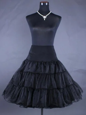 Black high-waist lolita petticoat with tiered ruffled organza skirt displayed on dress form, front flat view, featuring black waistband and voluminous bell silhouette characteristic of authentic lolita fashion