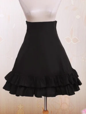 Black high-waist lolita skirt with double-layer ruffled hem front left side view on mannequin showing lace details and high waist design