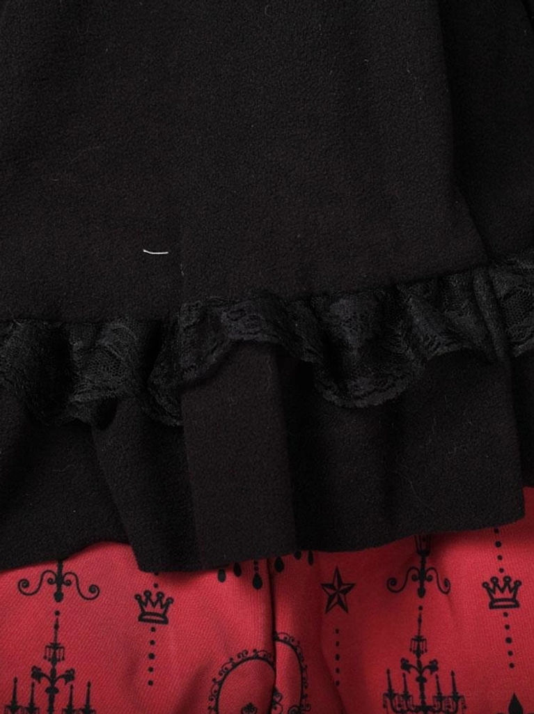 Black hooded lolita cape coat detail shot highlighting precision-cut lace embellishments and ruffled construction