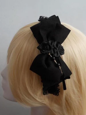Black lace flower bow lolita headdress with cross pendant side view on mannequin head showcase satin bow and fabric rose details