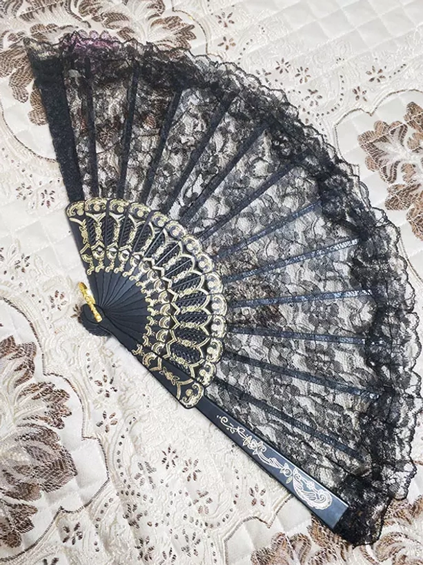 Black lace folding hand fan with gold carved ornate frame and ruffled lace trim victorian style lolita accessory detail view