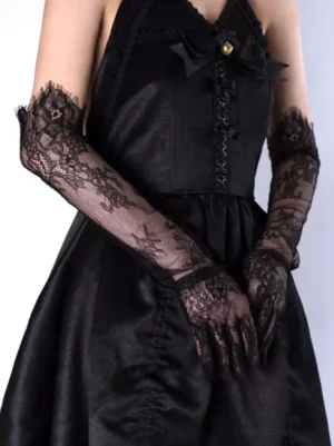 Black long lace gloves full arm coverage worn with gothic black dress front view showing intricate floral lace pattern and sheer fabric design